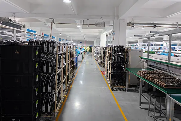 Staged robot vacuum hosts on factory racks