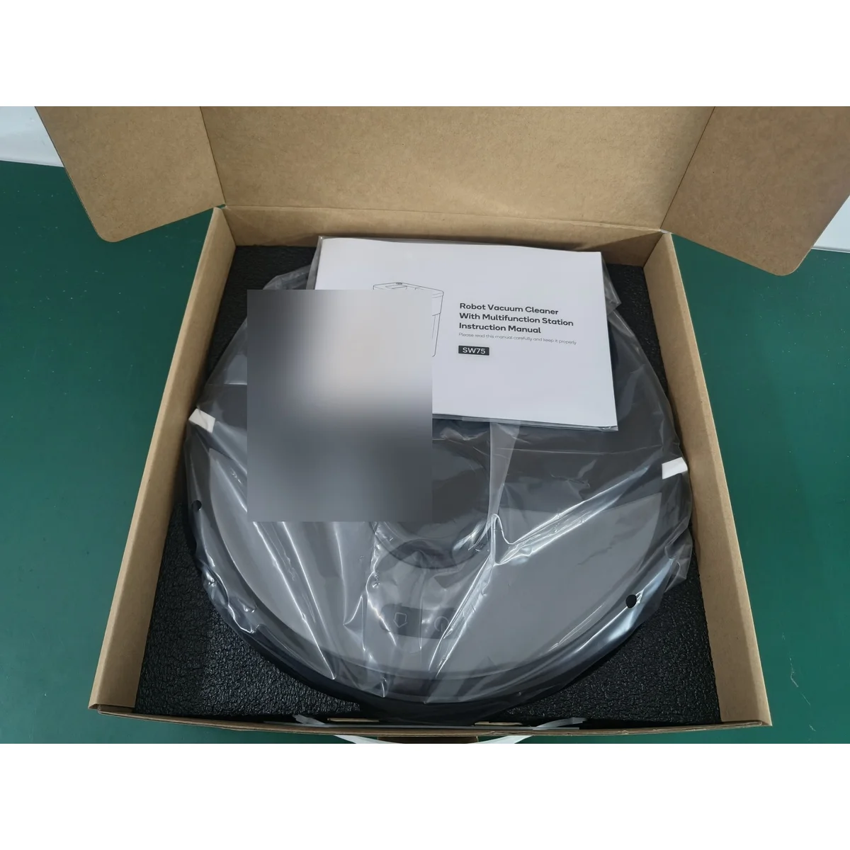 SW75 robot vacuum sealed in its retail box