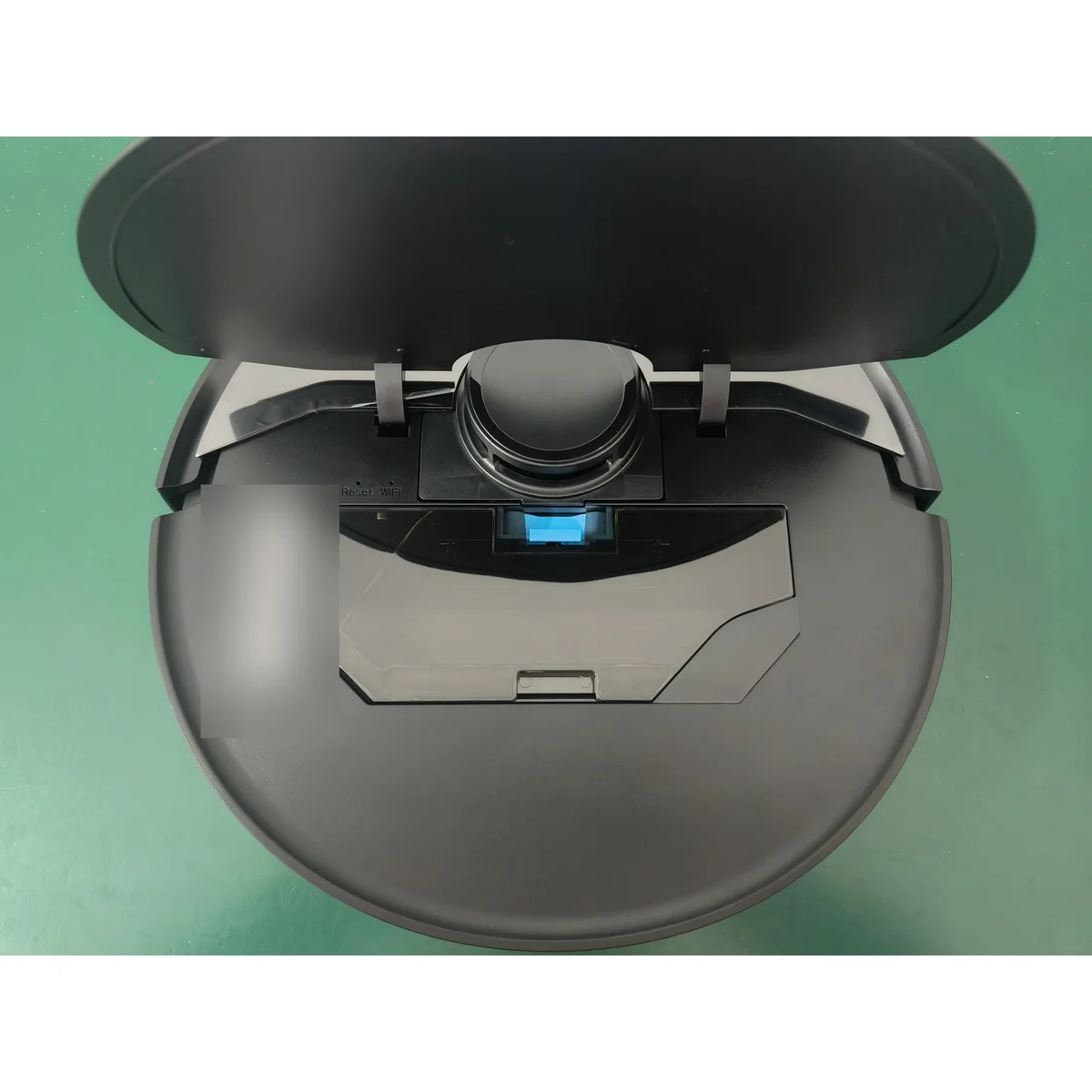 SW75 top with dustbin cover open, showing Wi-Fi and reset buttons